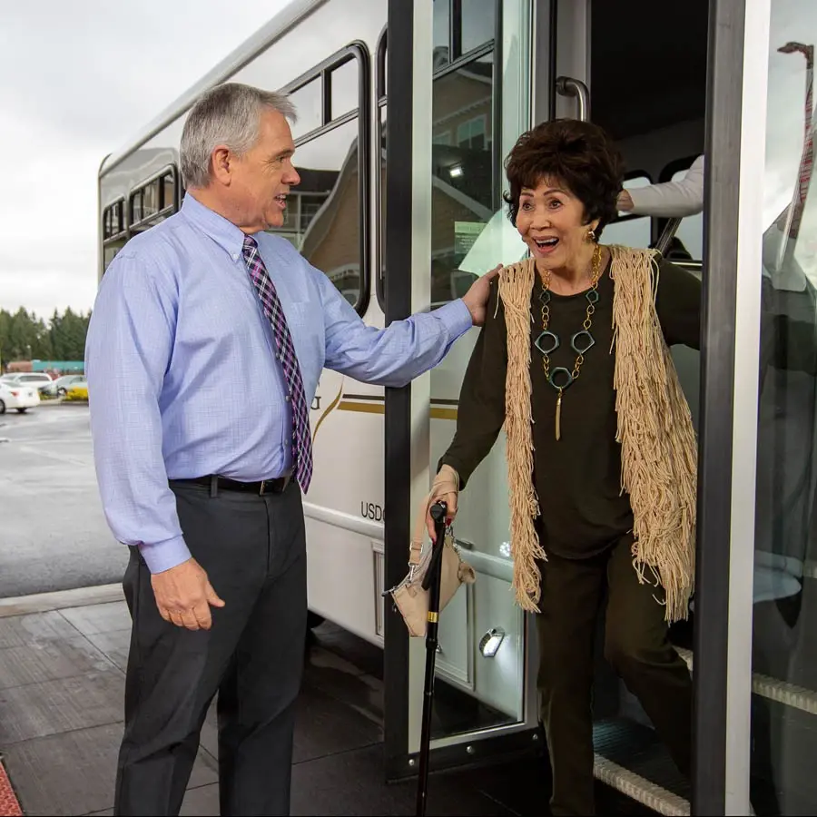 The Rio Grande man helping lady off bus
